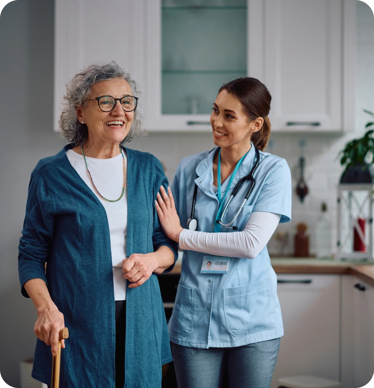 Smiling nurse assisting senior woman